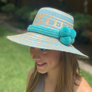 Shown with light turquoise pom pom hat band. 